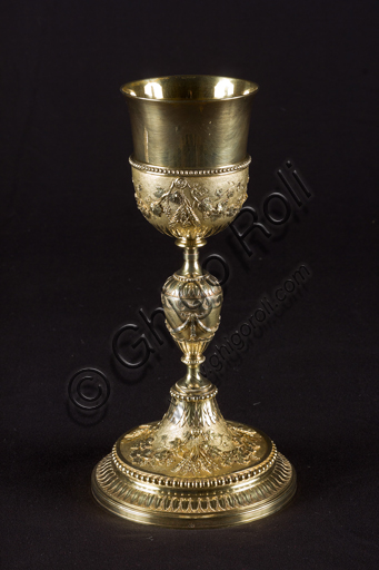   Genoa, Museum of the Treasury of the Cathedral of San Lorenzo: Chalice of St. Anthony of Prè; Rome workshop of Vincenzo Coaci; 1791;  embossed, chiseled, gilded silver. Decorations with the Symbols of Passion.