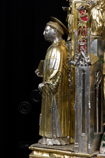   Genoa, Museum of the Treasury of the Cathedral of San Lorenzo: the Ark processional Ash St. John the Baptist. The Ark was commissioned by the Priors Chapel and was built by Teramo Danieli and Simone Caldera, 1438 - 1445, embossed silver, cast, gilt and enamels. The form proposes a Gothic church in miniature, in the central part are the stories of the Precursor: Announcement to Zechariah, Visitation, Birth; Imposition of the name, The Angel leads John in the desert, Preaching, and the Feast of Herod and the Burial. The corners: S. John the Evangelist, St. Matthew, St. George and St. Lawrence.