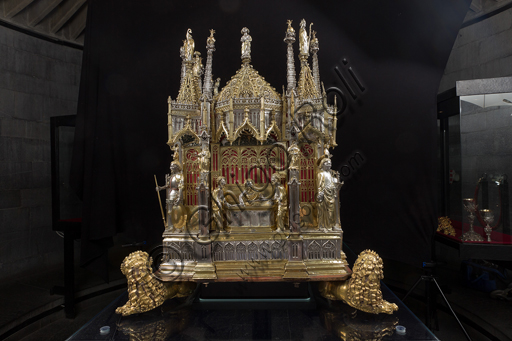   Genoa, Museum of the Treasury of the Cathedral of San Lorenzo: the Ark processional Ash St. John the Baptist. The Ark was commissioned by the Priors Chapel and was built by Teramo Danieli and Simone Caldera, 1438 - 1445, embossed silver, cast, gilt and enamels. The form proposes a Gothic church in miniature, in the central part are the stories of the Precursor: Announcement to Zechariah, Visitation, Birth; Imposition of the name, The Angel leads John in the desert, Preaching, and the Feast of Herod and the Burial. The corners: S. John the Evangelist, St. Matthew, St. George and St. Lawrence.