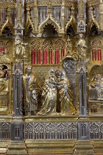   Genoa, Museum of the Treasury of the Cathedral of San Lorenzo: the Ark processional Ash St. John the Baptist. The Ark was commissioned by the Priors Chapel and was built by Teramo Danieli and Simone Caldera, 1438 - 1445, embossed silver, cast, gilt and enamels. The form proposes a Gothic church in miniature, in the central part are the stories of the Precursor: Announcement to Zechariah, Visitation, Birth; Imposition of the name, The Angel leads John in the desert, Preaching, and the Feast of Herod and the Burial. The corners: S. John the Evangelist, St. Matthew, St. George and St. Lawrence.