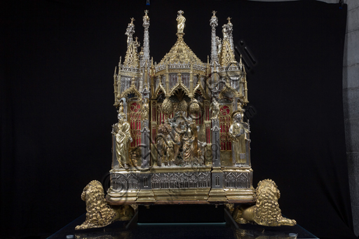   Genoa, Museum of the Treasury of the Cathedral of San Lorenzo: the Ark processional Ash St. John the Baptist. The Ark was commissioned by the Priors Chapel and was built by Teramo Danieli and Simone Caldera, 1438 - 1445, embossed silver, cast, gilt and enamels. The form proposes a Gothic church in miniature, in the central part are the stories of the Precursor: Announcement to Zechariah, Visitation, Birth; Imposition of the name, The Angel leads John in the desert, Preaching, and the Feast of Herod and the Burial. The corners: S. John the Evangelist, St. Matthew, St. George and St. Lawrence.