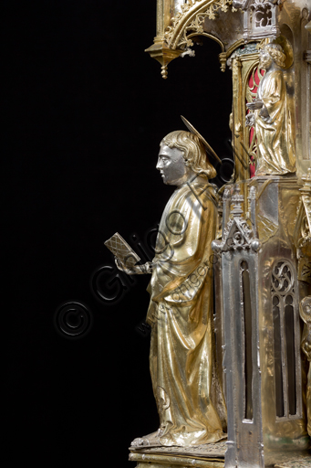   Genoa, Museum of the Treasury of the Cathedral of San Lorenzo: the Ark processional Ash St. John the Baptist. The Ark was commissioned by the Priors Chapel and was built by Teramo Danieli and Simone Caldera, 1438 - 1445, embossed silver, cast, gilt and enamels. The form proposes a Gothic church in miniature, in the central part are the stories of the Precursor: Announcement to Zechariah, Visitation, Birth; Imposition of the name, The Angel leads John in the desert, Preaching, and the Feast of Herod and the Burial. The corners: S. John the Evangelist, St. Matthew, St. George and St. Lawrence.