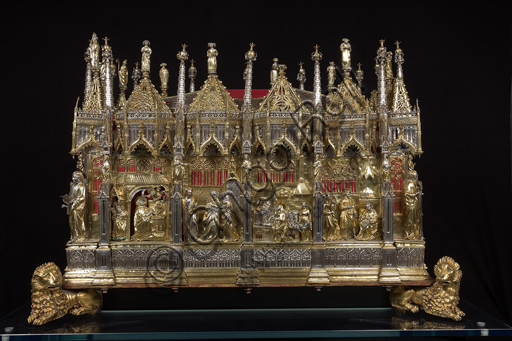   Genoa, Museum of the Treasury of the Cathedral of San Lorenzo: the Ark processional Ash St. John the Baptist. The Ark was commissioned by the Priors Chapel and was built by Teramo Danieli and Simone Caldera, 1438 - 1445, embossed silver, cast, gilt and enamels. The form proposes a Gothic church in miniature, in the central part are the stories of the Precursor: Announcement to Zechariah, Visitation, Birth; Imposition of the name, The Angel leads John in the desert, Preaching, and the Feast of Herod and the Burial. The corners: S. John the Evangelist, St. Matthew, St. George and St. Lawrence.