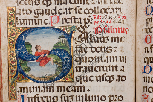 , Genova, the Diocesan Museum: Psalter, membranaceous manuscript by Genoa illuminators, 1485 - 1490. The young man who, in order not to be submerged by water, clings to the letter S (Salvus me fac Deus ...) is probably to be identified with David, the king of Israel to whom the 150 psalms were traditionally attributed of the Psalter.Detail.