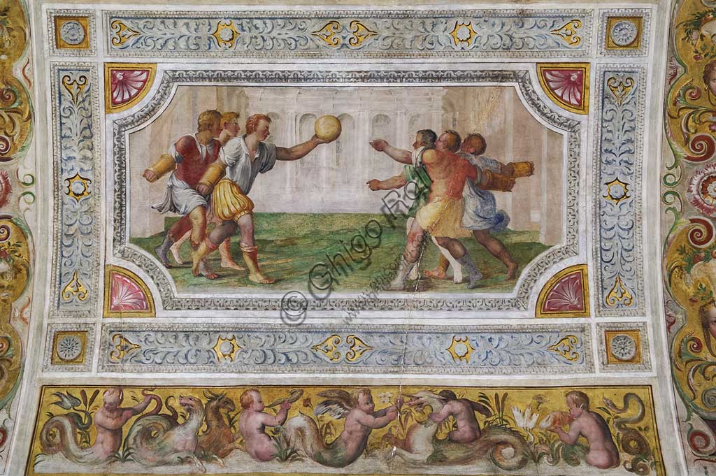 Ferrara, the Castello Estense (the Estense Castle), also known as Castle of St. Michael: detail of the ceiling of the Hall of Games,"The game of the ball at the bracelet". The frescoes are designed by Pirro Ligorio. The realization  is by Ludovico Settevecchi.