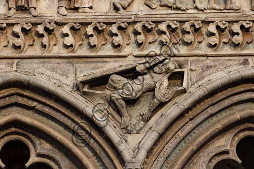 Ferrara, the Cathedral dedicated to St. George, façade: detail of the trabeation with the "Last Judgement".