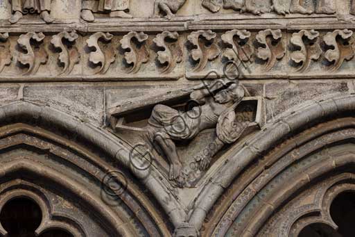 Ferrara, the Cathedral dedicated to St. George, façade: detail of the trabeation with the "Last Judgement".