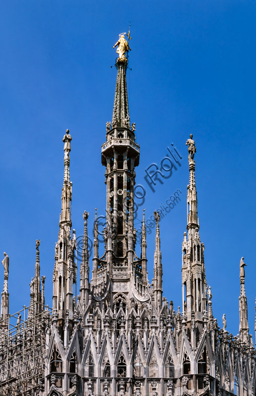  The spires of the Cathedral and the statue of the Madonnina seen from the Palace of the Veneranda Fabbrica.