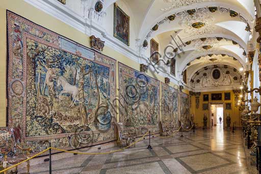   Isola Bella, the Borromeo Palace: the Tapestry Gallery. exhibits large tapestries, woven in wool and silk with gold and silver thread , and manufactured in Belgium. They were sent as a gift in 1787 by cardinal Vitaliano Borromeo VII to his nephew Gilberto V. Before that date, the precious tapestries may have been part of the collection of Cardinal Mazarin. The hypothetical belonging to the French prelate would also explain the choice of subjects that allegorically illustrate the theme of "sin" and that of "redemption", made ​​possible by Grace and Divine Providence. Tthey represent  "Evil" in the form of wild animals or mythical ones such as the unicorn, following a symbolism suggested by the ancient and Christian sources.