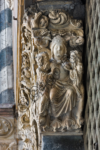 , Genoa, Duomo (St. Lawrence Cathedral), West side, the façade, the main doorway, left jamb, corbel: "Ecclesia feeding the Apostles Peter and Paul and two angels", by Master of the Ark of the Baptist, about 1225.