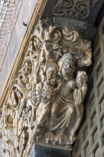 , Genoa, Duomo (St. Lawrence Cathedral), West side, the façade, the main doorway, left jamb, corbel: "Ecclesia feeding the Apostles Peter and Paul and two angels", by Master of the Ark of the Baptist, about 1225.