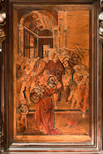 Genova, Duomo (Cattedrale di S. Lorenzo), interno,  presbiterio, abside, coro, lato nord: "L'elemosina di S. Lorenzo", tarsia lignea di Gian Michele De' Pantaleoni o Anselmo de' Fornari (secolo XVI).