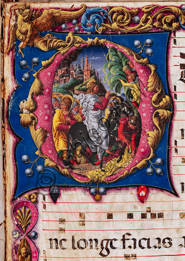 Libreria Piccolomini: corale cod. 22.7, cc. 2r con “Entrata di Cristo in Gerusalemme”, di Liberale da Verona  (1445 ca - 1527/9). 