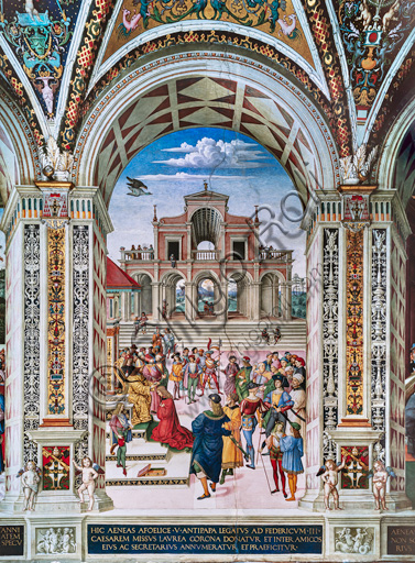 Libreria Piccolomini, parete nord-est: “Enea Silvio viene incoronato poeta dall’imperatore Federico III, 27 luglio 1442”, la terza delle dieci storie riguardanti Enea Silvio Piccolomini, futuro papa Pio II, (1503 - 1508), affresco di Bernardino di Betto, detto il Pinturicchio.