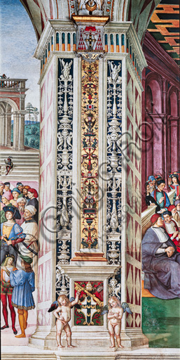 The Piccolomini Library, north-east wall: pilaster between  the third scene and the fourth scene of the ten stories about Aeneas Sylvius Piccolomini, future Pope Pius II, (1503 - 1508), frescoes  by Bernardino di Betto, known as Pinturicchio. In the dado, the Piccolomini emblem surmounted by the papal tiara and supported by two putti.