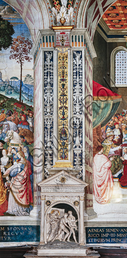 The Piccolomini Library, sout-east wall: pilaster between  the fifth scene and the sixth scene of the ten stories about Aeneas Sylvius Piccolomini, future Pope Pius II, (1503 - 1508), frescoes  by Bernardino di Betto, known as Pinturicchio. Below, the  stucco aedicule with high-relief, an old copy of the “Expulsion from the Garden of Eden”, sculpted by Jacopo della Quercia for the Fonte Gaia.
