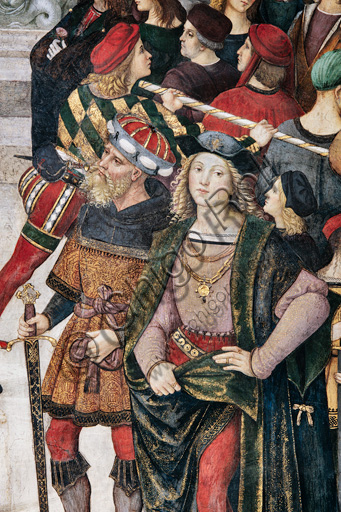 The Piccolomini Library, the exterior upper register: “Coronation of Pope Pius III (October 8, 1503)”, fresco by Bernardino  di Betto, known as Pinturicchio. Detail of the crowd of spectators held back by a guard and a dashingly handsome young man.