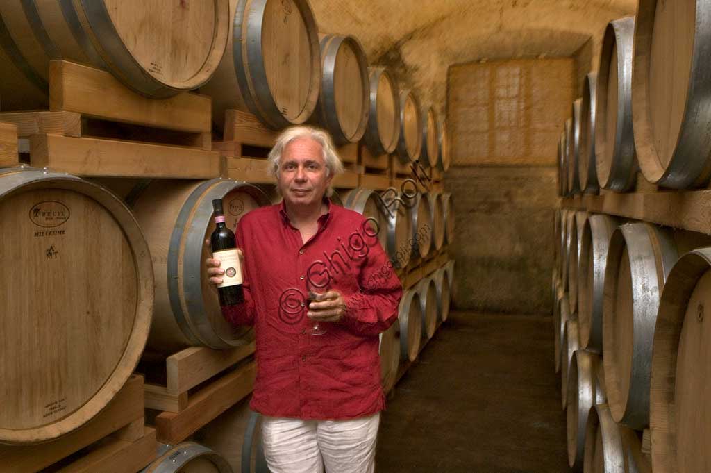 Winery Scacciadiavoli (in Cantinone locality): the owner, Guardigli, among the barrels of Sagrantino wine.