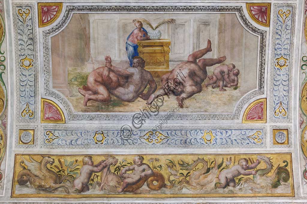 Ferrara, the Castello Estense (the Estense Castle), also known as Castle of St. Michael: detail of the ceiling of the Hall of Games,"Wrestling". The frescoes are designed by Pirro Ligorio. The realization of "Wrestling" is by Leonardo da Brescia.