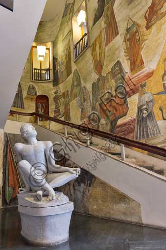   Padua, University, Palazzo Bo: the Atrium of Heroes ( dedicated to students fallen in the wars from 1848 to 1866, and  fallen during the Italian Resistance Movement). There is a  statue (1946-1947) by Arturo Martini representing Palinuro, the helmsman of Aeneas, who died in view of Italy.The design of the stair and the decoration of the walls are by Gio Ponti. The frescoes "The humanity and culture" (1941) depict  the birth and development of humanity, culture and sciences.