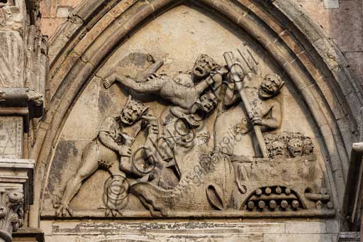 Ferrara, the Cathedral dedicated to St. George, façade: detail with lunette of the Damned.