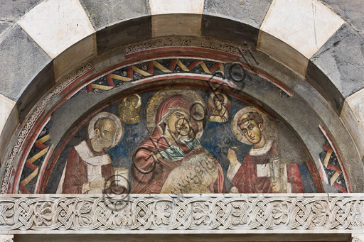 , Genoa, Duomo (St. Lawrence Cathedral), inside, the Southern aisle, southern wall, internal lunette of the portal of St. Gotthard: "Madonna  with Infant Jesus among St. Lawrence, St. Nicholas and two angels ", by Byzantine Master (about 1312).