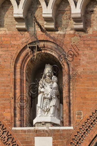 Piacenza, Piazza dei Cavalli (Horses Square),  Palazzo gotico (Gothic Palace): copy of the statue "Madonna with Infat Jesus", by Benedetto Antelami's school. The original statue is conserved at Farnese Palace.