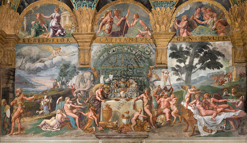 Mantova, Palazzo Te, Camera di Psiche: “Il banchetto nuziale di Amore e Psiche in un consesso di dei”. Nell’affresco di Giulio Romano si riconoscono Vulcano, Zefiro, Apollo, Bacco, Sileno, Cerere e Giunone. Ispirandosi alla favola di Amore e Psiche, contenuta nelle Metamorfosi di Apuleio, Giulio Romano affrescò questa parete tra il 1526 e il 1528. I dipinti gli furono commissionati da Federico II Gonzaga, duca di Mantova, per celebrare in questa residenza di campagna, dedicata al riposo e al piacere, il suo amore clandestino con Isabella Boschetti. La scena del  banchetto nuziale conclude le travagliatissime vicende dell’amore tra Psiche ed Eros: è una chiara allegoria degli amori del committente e, al tempo stesso, un auspicio. Psiche, cioè l’Anima ed Eros, l’Amore passionale, si uniscono finalmente in un sontuoso matrimonio benedetto da tutti gli dei. Il figlio che nascerà dalla loro unione, qui già raffigurato nel loro letto nuziale, si chiamerà Voluptas: il piacere perfetto che nasce dall’unione armoniosa di corpo e spirito.