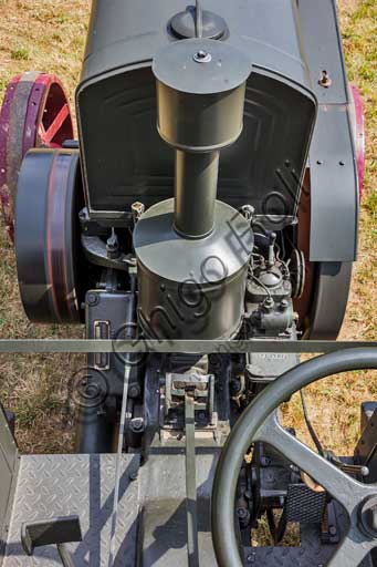 Old Tractor. Detail.Make: HSCS (Hofherr - Schrantz - Clayton - Shuttleworth)Model: K44-48Year: 1938 - 1942Fuel: crude oil and/or diesel oilNumber of Cylinders: Displacement: about 10.600 ccHorse Power: 44 HP at the wheel and 48 HP  at the PTO (Power Take-Off)Characteristics: 2-stroke diesel cycle. It had been used in the Second World War to pull the cannons, but then it was abandoned because it made too much noise and signaled the vehicle to the enemies.