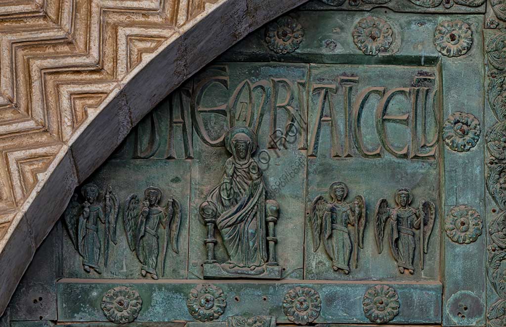  Monreale Cathedral, the gate by Bonanno Pisano (1185-6): bronze tile depicting "Enthroned Madonna" (scene of the New Testament).The gate is signed "Bonanno civis pisanus". It depicts five scenes of the Old Testament at the bottom, starting with Adam and Eve, and five scenes of the New Testament at the top, ending in "Christ and Mary in the glory of Paradise".