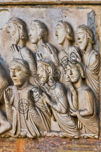 , Genoa, Duomo (St. Lawrence Cathedral), West side, the façade, the main doorway: detail of the lunette with "The Martyrdom of St. Lawrence", by Master of lunette of the Genoa Cathedral, 1225.Detail of a bystanders observing the martyrdom.