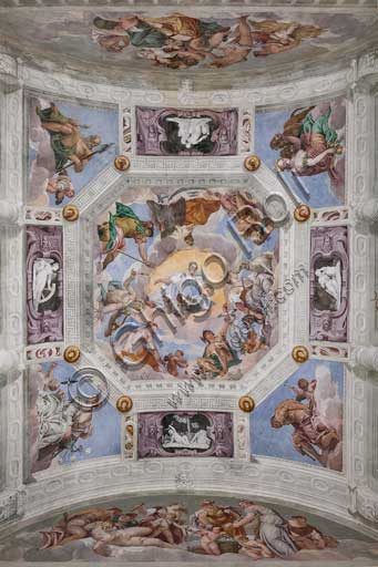  Maser, Villa Barbaro, the Hall of Olympus, the vault: the Olympus. In the corners  the four elements are depicted: Vulcan or the Fire, Cybele or the Earth, Neptune or the Water,  Juno or the Air. Among these representations, there are the representations,  in monochrome frescoes, of the Abundance (with the horn of plenty), the Fecundity, the Fortune (with the wheel), and Love. Int the central octagon, the Universal Harmony is surrounded by gods: Zeus with an eagle, Mars, Apollo with the lyre, Venus, Mercury with caduceus, Diana with dogs, and Saturn. Among the clouds near the frame there are  the signs of the zodiac. Frescoes by Paolo Caliari, known as il Veronese, 1560 - 1561.