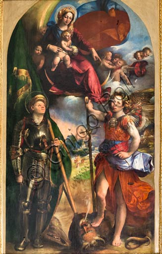 Modena, Galleria Estense: "Madonna con Bambino tra i Santi Giorgio e Michele Arcangelo",  di Giovanni Luteri, conosciuto come Dosso Dossi . Olio su tavola (circa 1518).