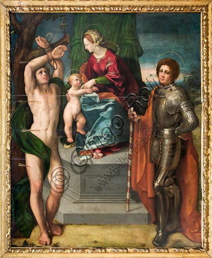  Modena, Galleria Estense: Madonna with Infant Jesus and ST. Sebastian and St. George, by Giovanni Luteri known as Dosso Dossi.