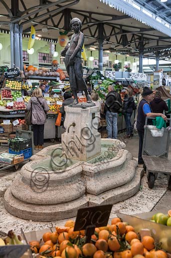 Modena, market in Albinelli street (the market was built in 1931 according to art nouveau style): statue of young girl with fruit basket, by Giuseppe Graziosi.