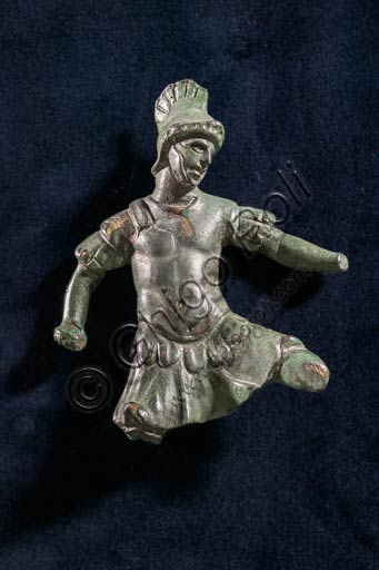 Modena, Museo Civico Archeologico Etnologico: Applique in bronzo raffigurante soldato in combattimento. Fossalta, Modena. I secolo d.C.(?). Arte romana.