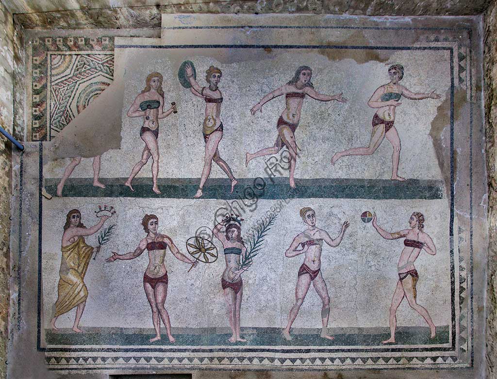 Piazza Armerina, Roman Villa of Casale, which was probably an imperial urban palace. Today it is a UNESCO World Heritage Site. Detail of the floor mosaic of the Room of the Girls representing athletes engaged in an athletics competition, wearing a two-piece swimsuit.It can be said that the girls depicted show how the bikini is a Roman invention.