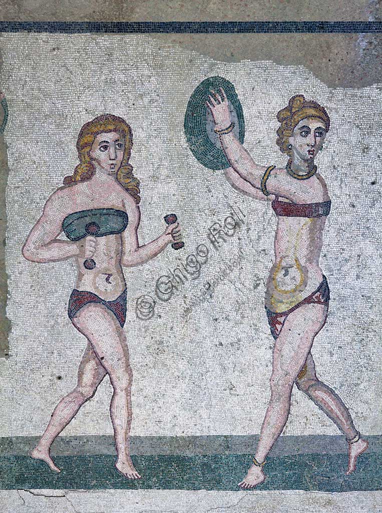 Piazza Armerina, Roman Villa of Casale, which was probably an imperial urban palace. Today it is a UNESCO World Heritage Site. Detail of the floor mosaic of the Room of the Girls representing athletes engaged in an athletics competition, wearing a two-piece swimsuit.It can be said that the girls depicted show how the bikini is a Roman invention.