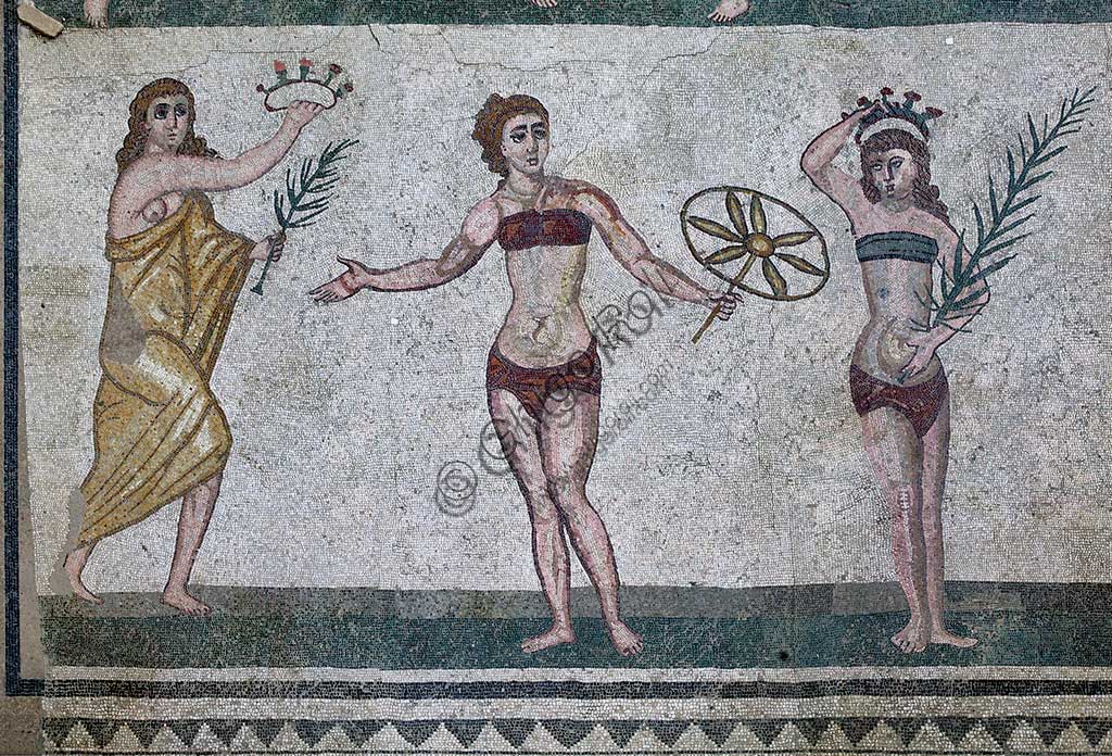 Piazza Armerina, Roman Villa of Casale, which was probably an imperial urban palace. Today it is a UNESCO World Heritage Site. Detail of the floor mosaic of the Room of the Girls representing athletes engaged in an athletics competition, wearing a two-piece swimsuit.It can be said that the girls depicted show how the bikini is a Roman invention.