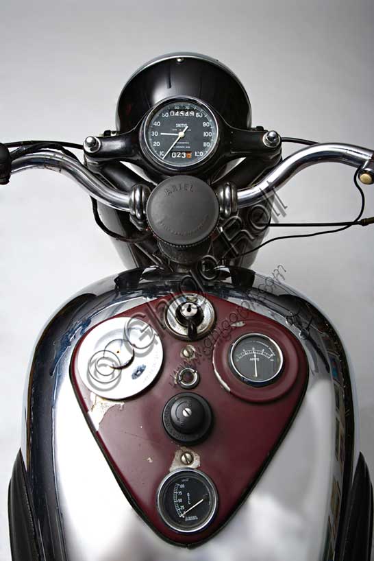 Vintage motorcycle “Ariel Square Four Mk1”Brand: Arielmodel: Square Four Mk1country: United Kingdom - Birminghamyear: 1950condition: preserveddisplacement: 995 cc (bore and stroke 65 x 75)engine: four-cylinder "square"gearbox: four-speedAlready known as a bicycle brand in the mid-nineteenth century, the evocative name of Ariel, Shakespearean spirit, reappeared in 1901 linked to the first motorcycle of a long series, which mounted a 211 cc engine. The Birmingham factory produced many single-cylinder and some twin-cylinder, until 1931 when, designed by Edward Turners, the "Square Four" was born, an engine that later became legendary. With a double parallel crankshaft and four cylinders arranged in a square, its design remains unique in the world motorcycle scene.This engine 