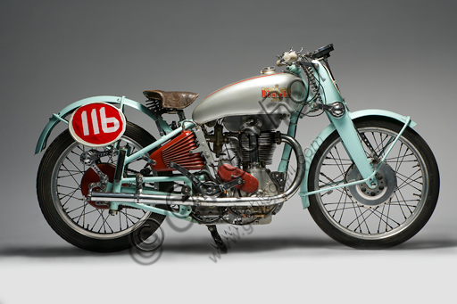 Vintage motorcycle “Bianchi Freccia Azzurra 500 Corsa”.Brand: Bianchi. model: Blue Arrow 500 Corsa. country: Italy - Milan. year: 1939. conditions: restored. displacement: 496 (bore and stroke 82 x 94). engine: single cylinder, four stroke. gearbox: separate four-speed.  Edoardo Bianchi, born in 1865, orphan raised by the "Martinitt" in Milan, made all the stages, none excluded, from the apprentice to the manufacturer of prestigious cars.  He built bicycles, De Dion Bouton motor tricycles, introduced pneumatic tires invented by Dunlop into Italy, built motor bicycles and finally some of the most beautiful motorcycles in Italian production.  Bianchi's name is forever linked to the glorious competitive season of the 1920s, when her motorcycles left very little space for competitors. Drivers like Alberto Ascari, Achille Varzi and Tazio Nuvolari drove them. The Blue Arrow was a project by the brilliant Mario Baldi and was the first to introduce the twin-shaft overhead distribution on a racing bike. The specimen reproduced in these pages was built only in three units. On one of these races Alberto Ascari ran.