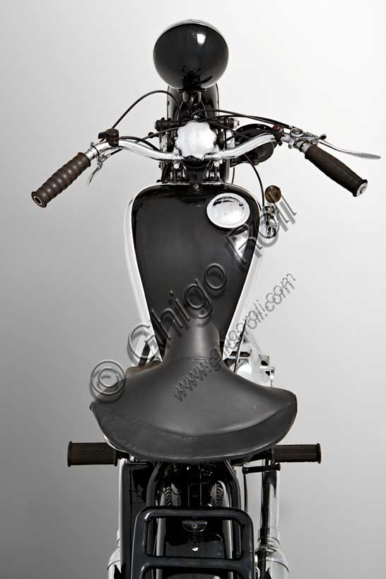 Vintage motorcycle “DKW UB 350 Sport”Brand: DKWmodel: UB 350 Sportcountry: Germany - Zschopauyear: 1936condition: restoreddisplacement: 350engine: two-stroke single-cylinder flat-washgearbox: three-speedDKW was founded by the Danish engineer Jorge Skafte Rasmussen as a car factory. In 1919, based on a design by Hugo Ruppe, he built an engine to be applied to bicycles that, playing on the company's initials, was named Das Kleine Wunder, "The Little Wonder". Thus began the rise of that brand that with dozens of models, would set Germany in motion in the 1930s and, in 1938, would reach, the first motorcycle manufacturer in the world, the figure of one million units produced.This 350 has a two-stroke engine (like almost all the models from the company), but with flat scavenge intake, two intake ports, double transfer, aluminium piston.