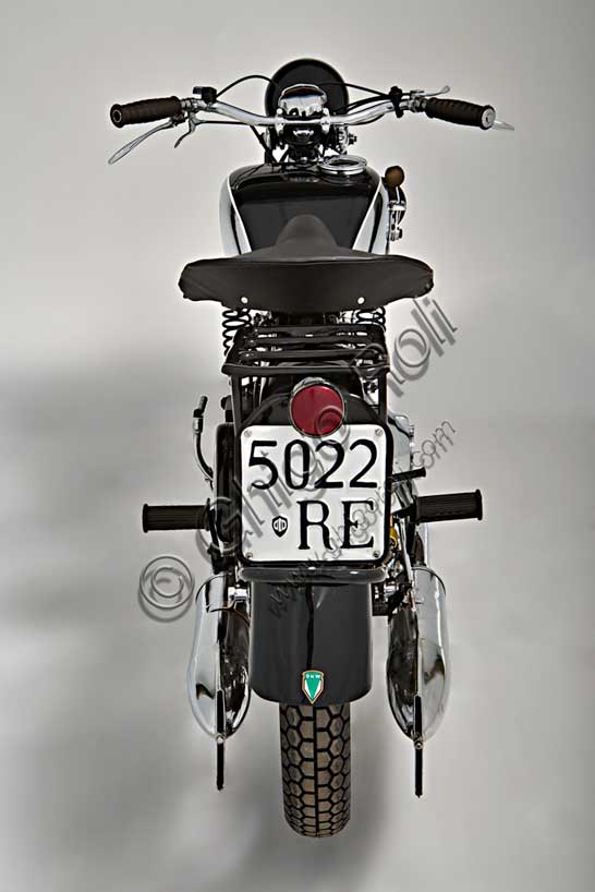 Vintage motorcycle “DKW UB 350 Sport”Brand: DKWmodel: UB 350 Sportcountry: Germany - Zschopauyear: 1936condition: restoreddisplacement: 350engine: two-stroke single-cylinder flat-washgearbox: three-speedDKW was founded by the Danish engineer Jorge Skafte Rasmussen as a car factory. In 1919, based on a design by Hugo Ruppe, he built an engine to be applied to bicycles that, playing on the company's initials, was named Das Kleine Wunder, "The Little Wonder". Thus began the rise of that brand that with dozens of models, would set Germany in motion in the 1930s and, in 1938, would reach, the first motorcycle manufacturer in the world, the figure of one million units produced.This 350 has a two-stroke engine (like almost all the models from the company), but with flat scavenge intake, two intake ports, double transfer, aluminium piston.