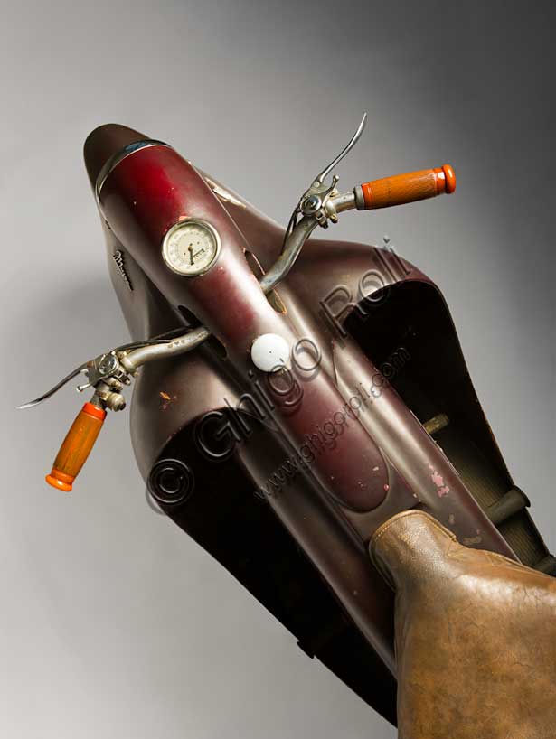 Vintage motorbike Mayor.Brand: Mayorcountry: Italy - Turinyear: 1947conditions: preserveddisplacement: 349.3 cc. (bore and stroke 76 x 77)engine: vertical single cylinder with overhead valvesgearbox: four-speed with pedal controland final shaft transmissionOne of the most futuristic projects in the history of the motorcycle is due to Salvatore Maiorca, (hence the name of the motorcycle), a brilliant engineer well known in Turin. The Mayor, of which this unique prototype survives, built in the Aeritalia workshops of the Fiat group and thought probably for the municipal police. It has load-bearing and enveloping bodywork that integrates the headlight and mudguards, indirect steering, forced air-cooled aeronautical engine, longitudinal crankshaft that extends in the block gear