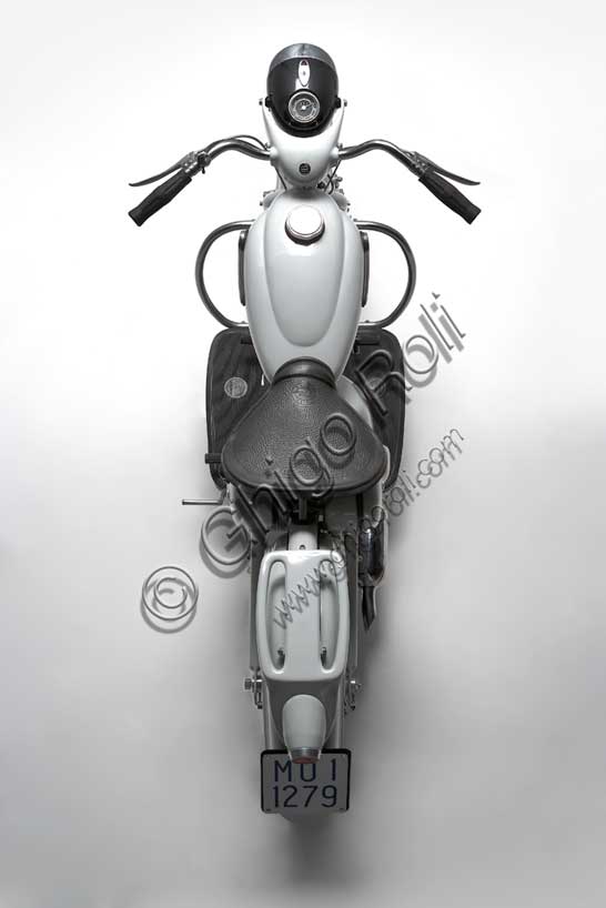 Vintage motorcycle (scooter) “Motom Delfino”Brand: Motommodel: Delfinocountry: Italyyear: 1954condition: restoreddisplacement: 163 cc. (bore and stroke 62 x 54engine: single-cylinder four-strokegearbox: four-speed blockAs the name and the line of the mudguards suggest, the Delfinocombines a harmonious and natural aesthetic with technical solutions that make it reliable and safe. It was designed by engineer Battista Falchetto following the philosophy of the company that always sought cutting-edge solutions both in style and in the quality of innovations. It went into production in 1951. Halfway between a scooter and a motorcycle, it is characterized by forced air cooling, suspension that does not sink, very rigid frame. Solutions that will make it very popular. It was produced in over 6500 units.