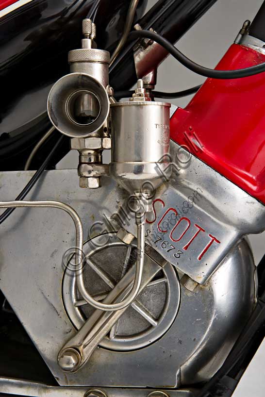 Vintage motorcycle “Scott Super Squirrel”Brand: Scottmodel: Super Squirrelcountry: United Kingdom - Shipleyyear: 1926 (?)condition: restoreddisplacement: 596engine: two-stroke twin-cylinder water-cooledgearbox: two-speedFounded in Shipley, Yorkshire, by Alfred Angus Scott, creator of more than fifty patents, the Scott factory produced motorcycles from 1909 to 1933. Several particularly innovative solutions were adopted in series production. The Scott was the first motorcycle to adopt water cooling. Some construction choices such as the open triangle frame, allowing the vehicle to be used by a female public, seemed to indicate the desire to address a “relaxed” user base. Despite this, the Scott soon proved to be a fast and efficient motorcycle, collecting numerous sporting successes. It reached 105 km/h. It won the Tourist Trophy in 1912 and 1913.