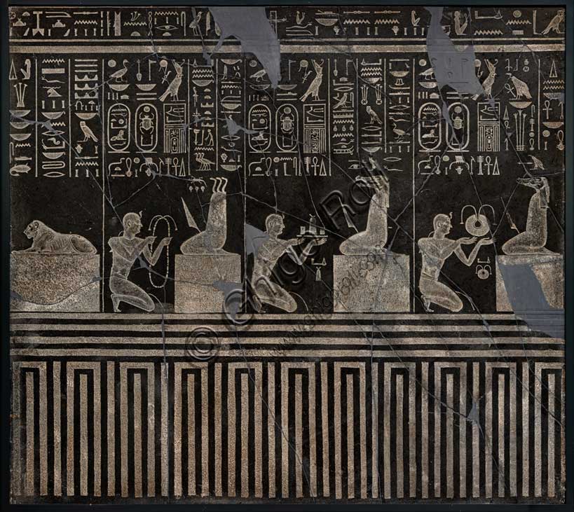 Museo Civico Archeologico di Bologna: rilievo di Nectanebo I nell'atto di compiere offerte a vari demoni. Diabase (o scisto nero?), in origine collocato nel Tempio di Atum ad Heliopolis, XXX dinastia (regno di Nectanebo I, 380-362 a.C.), Epoca Tarda. Inventario EG 1870.