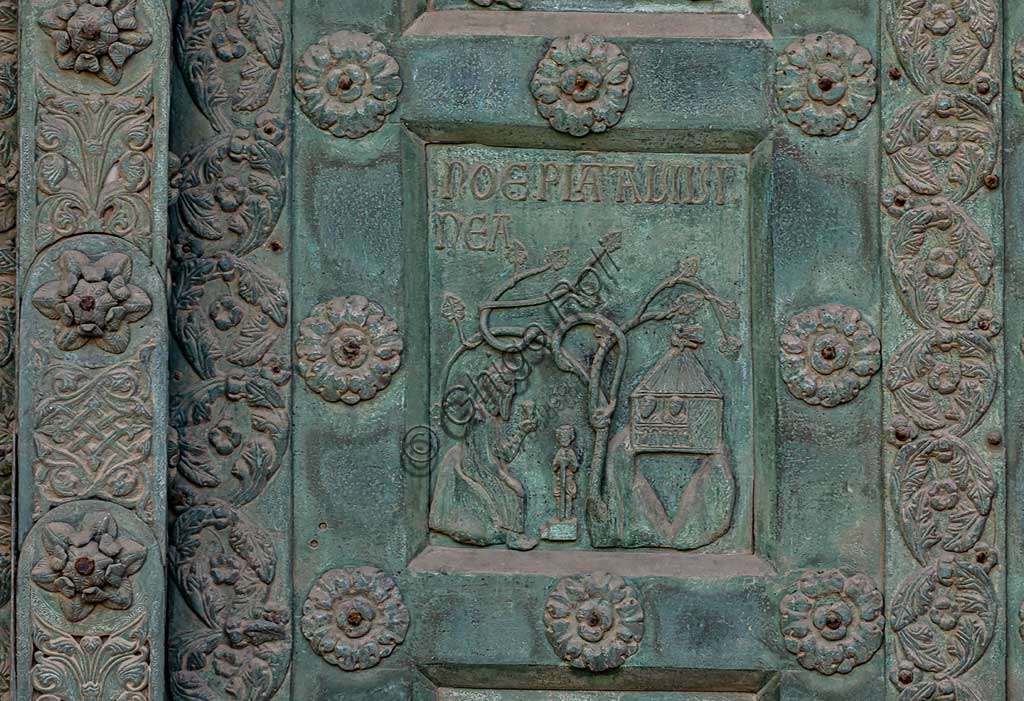 Duomo di Monreale, Porta di Bonanno Pisano (1185-6): formella bronzea con "Noè coltiva la vigna" (scena dall'Antico Testamento).La porta è firmata: "Bonanno civis pisanus". Iconograficamente nei cinque ordini inferiori vi sono scene del Vecchio Testamento, sette dedicate alla storia di Adamo ed Eva, e altre sei ad altrettante coppie di profeti mentre nei cinque superiori scene del Nuovo, al sommo Cristo e Maria nella gloria del Paradiso.