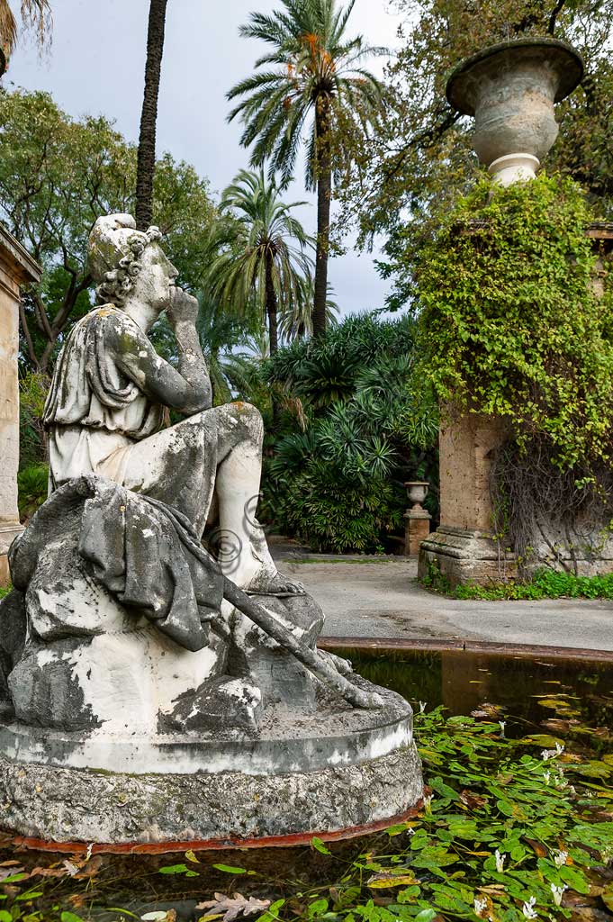 Palermo, the Botanical Gardens: a fountain with a statue.