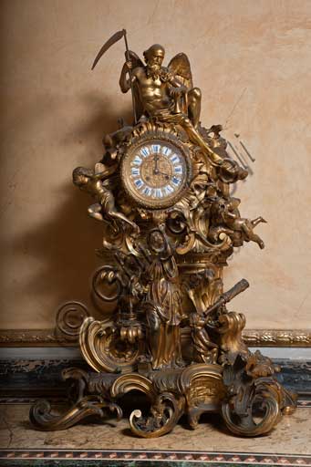 Palermo, The Royal Palace or Palazzo dei Normanni (Palace of the Normans), The Royal Apartment, The Yellow Room: table clock in  golden bronze, XIX century (Cronus, the Time with the Scythe).